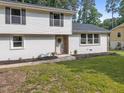 Charming two-story home featuring manicured lawn, updated windows and neutral paint colors at 1143 Sturdivant Dr, Cary, NC 27511