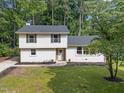 Charming two-story home featuring manicured lawn, updated windows and neutral paint colors at 1143 Sturdivant Dr, Cary, NC 27511
