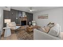 Inviting living room featuring fireplace, neutral color palette, and wood floors at 1143 Sturdivant Dr, Cary, NC 27511