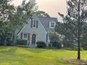Well-maintained home with a manicured lawn, gray siding, and appealing curb appeal at 11609 Us 401, Fuquay Varina, NC 27526