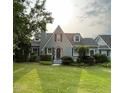 Attractive home with gray siding, a manicured lawn, and an inviting front entrance at 11609 Us 401, Fuquay Varina, NC 27526