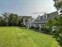 Spacious home with a large grassy yard and established landscaping at 11609 Us 401, Fuquay Varina, NC 27526