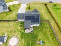 Home featuring a large backyard, solar panels, patio area, and play area for outdoor enjoyment at 137 Clydes Point Way, Wendell, NC 27591