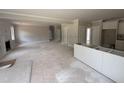 Spacious living room flowing into the kitchen area, awaiting customization, with ample natural light at 145 Tee Dr, Selma, NC 27576