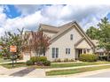 Beautiful two-story home with tidy landscaping, including a small tree with magenta flowers at 215 Dungarven Loop, Cary, NC 27513