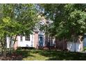 Charming brick home with a well-manicured lawn and mature trees at 227 Shalimar Dr, Durham, NC 27713