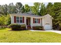 A cozy single-story home features a well-kept lawn, red shutters, and an attached single car garage at 518 S Coalport Dr, Apex, NC 27502