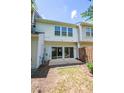 Private backyard with sliding doors and a cozy patio space perfect for outdoor relaxation at 5209 Echo Ridge Rd, Raleigh, NC 27612