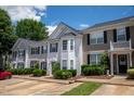 Attractive townhomes featuring coordinated exteriors, well-manicured landscaping, and convenient parking at 5209 Echo Ridge Rd, Raleigh, NC 27612