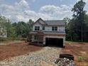 Exterior view of a home under construction with visible framing and construction materials at 5504 Jaeger Dr # 76, Graham, NC 27253