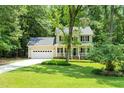 Beautiful two-story home with a well-kept lawn, attached garage, and a welcoming front porch at 7021 Oviedo Dr, Raleigh, NC 27603