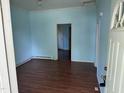 This living room has light blue walls and wood flooring at 709 Gerard St, Durham, NC 27701