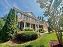 Beautiful brick home with manicured landscaping and a side-entry two-car garage at 9409 Collingdale Way, Raleigh, NC 27617