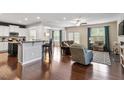 Spacious living room featuring hardwood floors, modern furniture, a fireplace and lots of natural light at 108 White Burley Ct, Durham, NC 27703