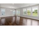 Spacious living room featuring hardwood floors, bright natural light, and neutral paint at 1205 Steinbeck Dr, Durham, NC 27703