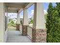 Inviting porch with stone accents and white railings, offering a perfect spot to relax at 1205 Steinbeck Dr, Durham, NC 27703