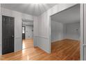 Bright entryway featuring hardwood floors, classic wallpaper, and neutral trim at 129 Castle Dr, Smithfield, NC 27577