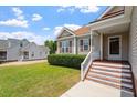 This lovely home boasts charming curb appeal with a well-maintained lawn and inviting entrance at 1325 Sweetclover Dr, Wake Forest, NC 27587