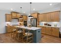 Spacious kitchen with a large island, modern appliances, and beautiful wood cabinets, perfect for cooking at 134 Beacon Dr, Pittsboro, NC 27312