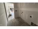 Unfinished laundry room with washer and dryer hookups, offering customization options at 183 Tee Dr, Selma, NC 27576