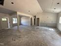 Open-concept living space with high ceilings, ample natural light, and versatile layout, awaiting your personal touch at 183 Tee Dr, Selma, NC 27576