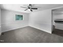 Well-lit bedroom with a ceiling fan, neutral walls, and carpeted flooring, ready for personalization at 1914 Adams Pl, Hillsborough, NC 27278