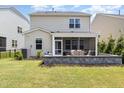 Backyard with a stone patio and a screened-in porch at 2128 Jollay St, Durham, NC 27703