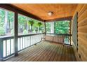 View of the covered porch with a swing and hanging plants, perfect for relaxing at 2416 Kearney Rd, Wake Forest, NC 27587