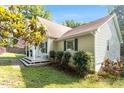 Lovely single-story home with a covered porch, green shutters, and mature trees at 3298 Oakridge Dr # A, Graham, NC 27253
