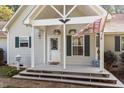 Welcoming front porch with decorative accents and space for outdoor seating at 3298 Oakridge Dr # A, Graham, NC 27253