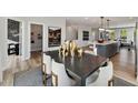 Spacious dining area adjacent to kitchen featuring open floor plan and modern decor at 410 Gaston Park Ln # 200, Wake Forest, NC 27587
