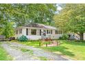 Quaint single-story home with beautiful curb appeal, featuring a well-kept lawn at 422 Hyde St, Burlington, NC 27217
