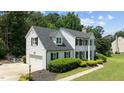 Two-story home with attached garage, manicured landscaping, and a well-maintained lawn at 5301 Night Heron Dr, Wake Forest, NC 27587