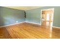 Spacious living room featuring hardwood floors and neutral paint at 5504 Balsam Pl, Raleigh, NC 27603