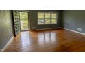 Bright living room featuring hardwood floors and natural light at 5504 Balsam Pl, Raleigh, NC 27603