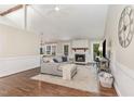 Cozy living room features a fireplace, hardwood floors, and ample natural light at 5617 Groomsbridge Ct, Raleigh, NC 27612