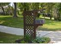 Decorative mailbox in a landscaped area adds curb appeal to this lovely home at 5617 Groomsbridge Ct, Raleigh, NC 27612