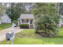Quaint home with a lush green lawn and a classic mailbox at 5817 Seward Dr, Knightdale, NC 27545