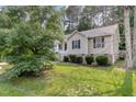 Well-maintained lawn surrounds the side of this cozy home at 5817 Seward Dr, Knightdale, NC 27545