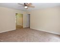 Inviting living room with neutral tones and a view into an adjacent room at 5949 Sandy Run, Knightdale, NC 27545