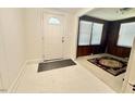 Welcoming entryway featuring tile flooring and a traditional-style front door at 1112 N Driver St, Durham, NC 27701