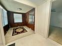Living room with multiple windows, offering natural light, and an area rug at 1112 N Driver St, Durham, NC 27701
