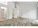 Spacious bedroom with unique wood floors and loft access, creating a cozy and inviting atmosphere at 120 Polks Landing Rd, Chapel Hill, NC 27516