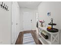 Inviting entryway featuring hardwood floors, neutral walls, and a decorative console table at 145 Bounding Ln, Youngsville, NC 27596