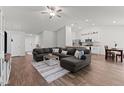 Spacious open-concept living room with modern decor, vaulted ceilings, and seamless flow to the kitchen at 145 Bounding Ln, Youngsville, NC 27596
