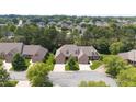 Lovely landscaped brick home features mature trees and a well-manicured lawn in established neighborhood at 2012 Muirfield Ct, Elon, NC 27244