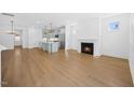 Spacious living room with fireplace, hardwood floors, and ample natural light at 212 Aubey Ln, Wake Forest, NC 27587
