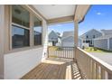 View from the covered porch overlooking the lawn and surrounding neighborhood at 212 Aubey Ln, Wake Forest, NC 27587