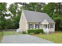 Beautifully maintained house with a manicured lawn and charming curb appeal at 2708 Sundial Cir, Durham, NC 27704