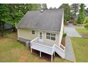 Exterior rear view featuring a small deck and backyard, perfect for outdoor relaxation at 2708 Sundial Cir, Durham, NC 27704